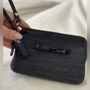Coach Black Corner Zip Bow Wristlet In Signature Canvas